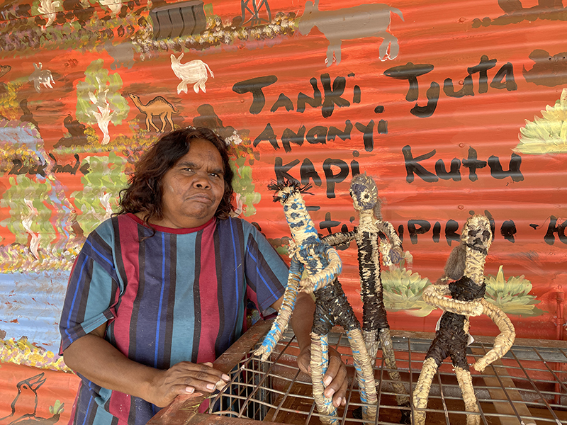 Lynette Lewis with works for Desert Mob 2025. photo Kate Murphy. © Tjanpi Desert Weavers, NPY Women’s Council